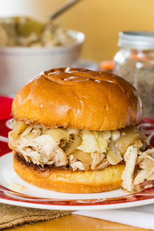 <p>Chicken is simmered all day with apples and hard cider for an incredible flavor, especially when you pile it on sandwiches with sharp cheddar. Get this <a href="https://cupcakesandkalechips.com/slow-cooker-apple-cider-pulled-chicken-sandwiches-weekdaysupper/" rel="nofollow noopener" target="_blank" data-ylk="slk:Apple Cider Slow Cooker Pulled Chicken;elm:context_link;itc:0;sec:content-canvas" class="link ">Apple Cider Slow Cooker Pulled Chicken</a> recipe!</p>