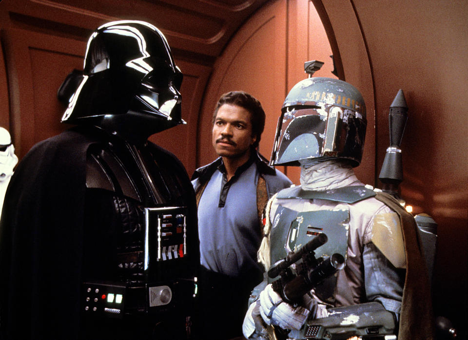 Darth Vader and Boba Fett strike a bargain while Lando Calrissian looks on in 'The Empire Strikes Back' (Photo: Lucasfilm/courtesy Everett Collection)