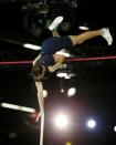 Renaud Lavillenie of France clears the bar at 5.90 meters during the men's pole vault event at the IAAF World Indoor Athletics Championships in Portland, Oregon March 17, 2016. REUTERS/Mike Blake