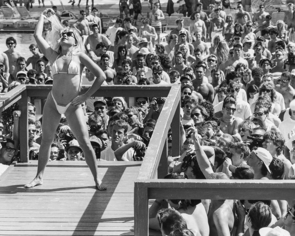 A bikini contest competitor works the crowd, March 1991.