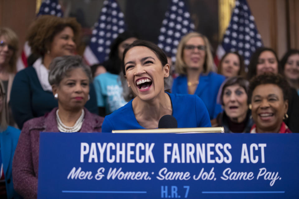 Rep. Alexandria Ocasio-Cortez, D-N.Y., smiles as she speaks at an event to advocate for the Paycheck Fairness Act on the 10th anniversary of President Barack Obama signing the Lilly Ledbetter Fair Pay Act, at the Capitol in Washington, Wednesday, Jan. 30, 2019. The legislation, a top tier issue for the new Democratic majority in the House, would strengthen the Equal Pay Act of 1963 and guarantee that women can challenge pay discrimination and hold employers accountable.(AP Photo/J. Scott Applewhite)