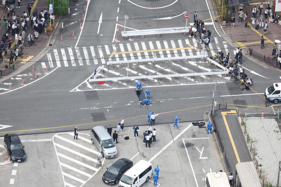 An aerial view taken shows police working at the scene at Kintetsu Yamato-Saidaiji Station in Nara