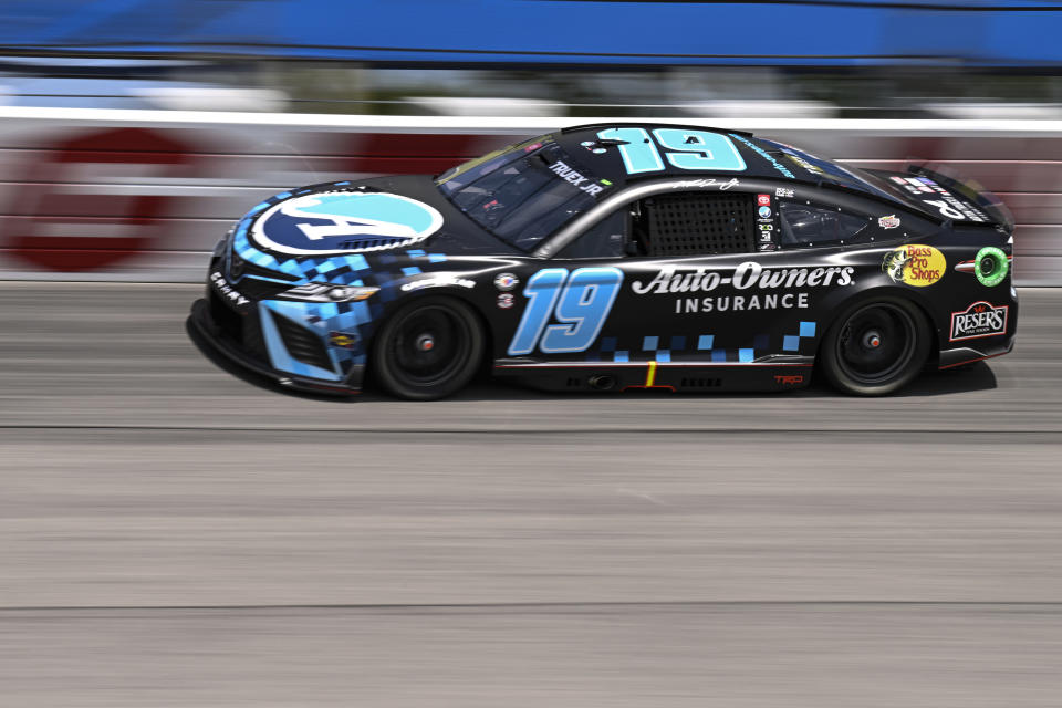 Martin Truex Jr. (19) steers into Turn 1 during a NASCAR Cup Series auto race at Darlington Raceway, Sunday, May 14, 2023, in Darlington, S.C. (AP Photo/Matt Kelley)