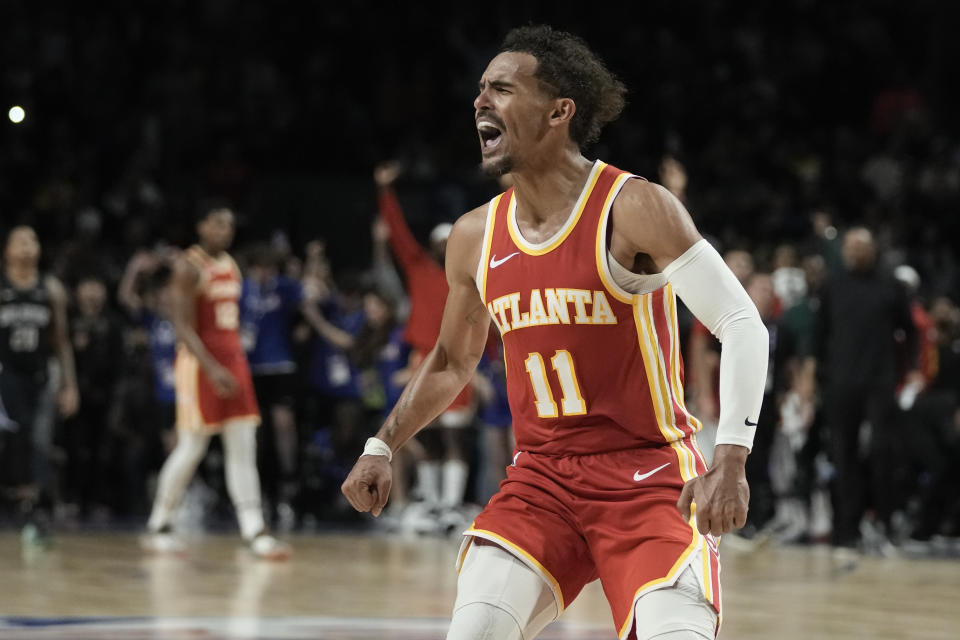 Atlanta Hawks' Young Trae celebrates after beating the Orlando Magic in an NBA basketball game, at the Mexico Arena in Mexico City, Thursday, Nov. 9, 2023. (AP Photo/Eduardo Verdugo)