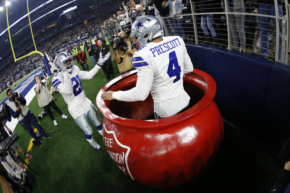 The Salvation Army bucket is just one of the ways the organization has appeared at Cowboys games. (AP Photo/Ron Jenkins)