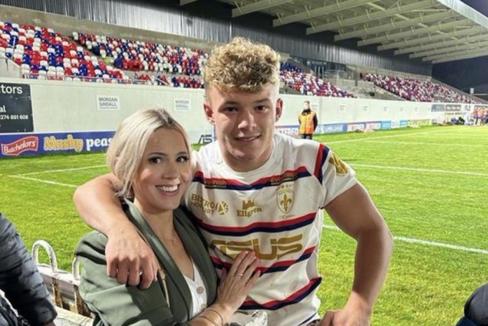 Harvey Smith, pictured here with his mum, made his debut in a match that saw him face off against another Brigshaw alumnus, Jack Walker, (Photo: Contributed)