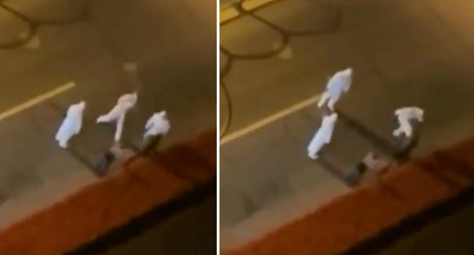 An unverified video shows a person being beaten by pandemic workers. Source: Weibo