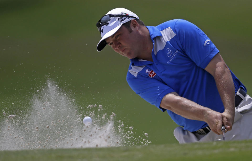 Andrew Svoboda hits out of the sand onto the 18th green during the opening round of the Zurich Classic golf tournament at TPC Louisiana in Avondale, La., Thursday, April 24, 2014. (AP Photo/Gerald Herbert)