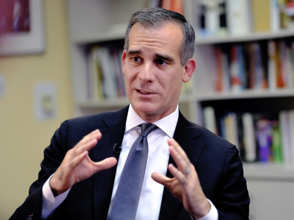 FILE - In this Aug. 16, 2018 file photo, Los Angeles Mayor Eric Garcetti talks during an interview about homelessness in Los Angeles. Garcetti says he hopes President Donald Trump will work with the city to end homelessness as the president visits California for a series of fundraisers. Garcetti says the federal government could aid Los Angeles with surplus property or money to create additional shelters. Garcetti says he has not been invited to meet with the president. (AP Photo/Richard Vogel, File)