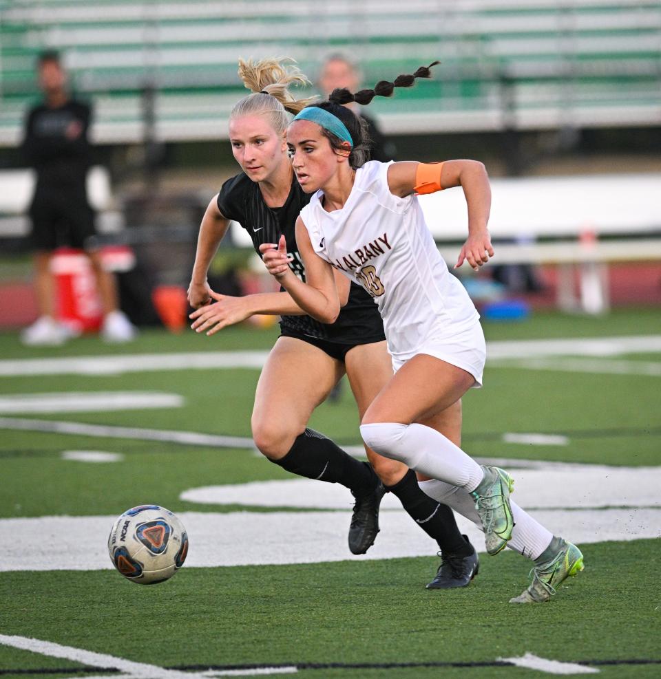 New Albany senior midfielder Allie Metcalf, right, was first-team all-state last season.