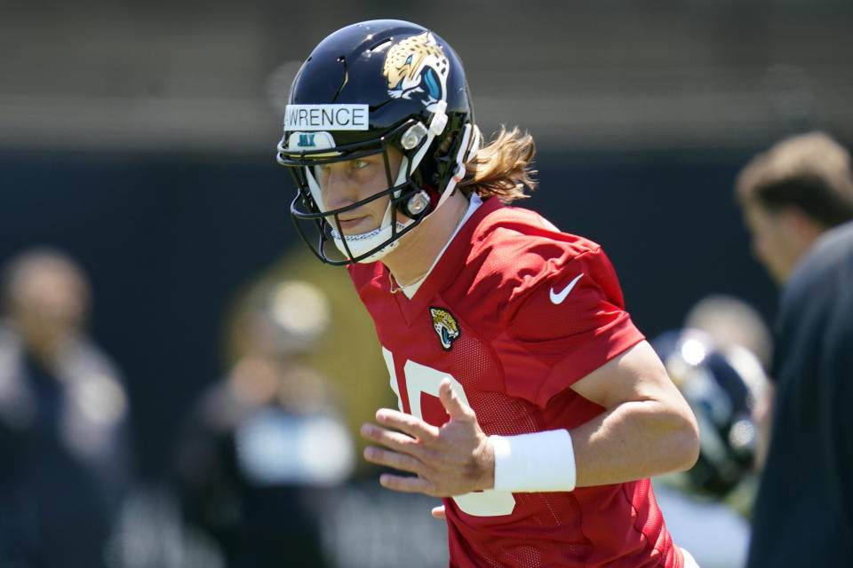 How much running with Jacksonville Jaguars quarterback Trevor Lawrence do this season? Even he's not sure. (AP Photo/John Raoux)