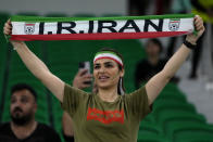 A fan holds up a scarf prior the start of the World Cup group B soccer match between Iran and the United States at the Al Thumama Stadium in Doha, Qatar, Tuesday, Nov. 29, 2022. (AP Photo/Manu Fernandez)