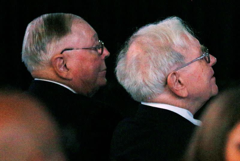 FILE PHOTO: Berkshire Hathaway Chairman Buffett and Vice Chairman Munger wait to begin the company's annual meeting in Omaha