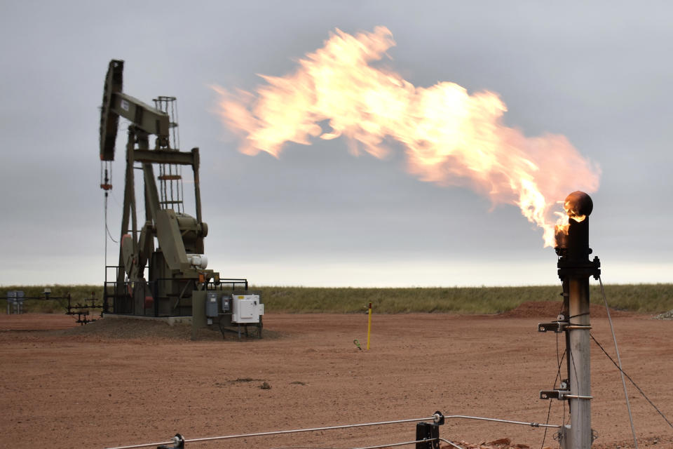 FILE - A flare burns excess natural gas at an oil well on Aug. 26, 2021, in Watford City, N.D. Republican politicians across the U.S. are criticizing President Joe Biden over his domestic energy policies and urging his administration to do more to ramp up domestic production. The sanctions imposed by the U.S. and its allies on Russia for its war with Ukraine so far do not include oil and gas exports from the country, a step that would severely hurt Russia’s ability to generate revenue. (AP Photo/Matthew Brown, File)