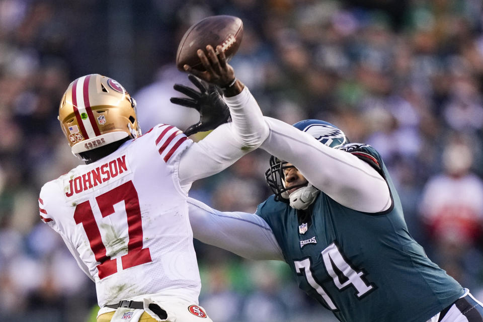 San Francisco 49ers quarterback Josh Johnson, left, attempts a pass as Philadelphia Eagles defensive tackle Ndamukong Suh applies pressure during the second half of the NFC Championship NFL football game between the Philadelphia Eagles and the San Francisco 49ers on Sunday, Jan. 29, 2023, in Philadelphia. (AP Photo/Matt Slocum)