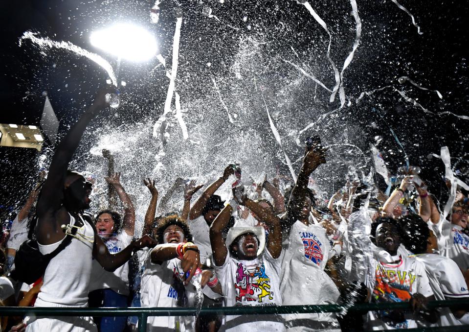 Cooper High students on the home side of Friday’s crosstown showdown against Abilene High throw ribbons and fling water into the air during a third quarter show of school spirit at Shotwell Stadium Sept. 1.