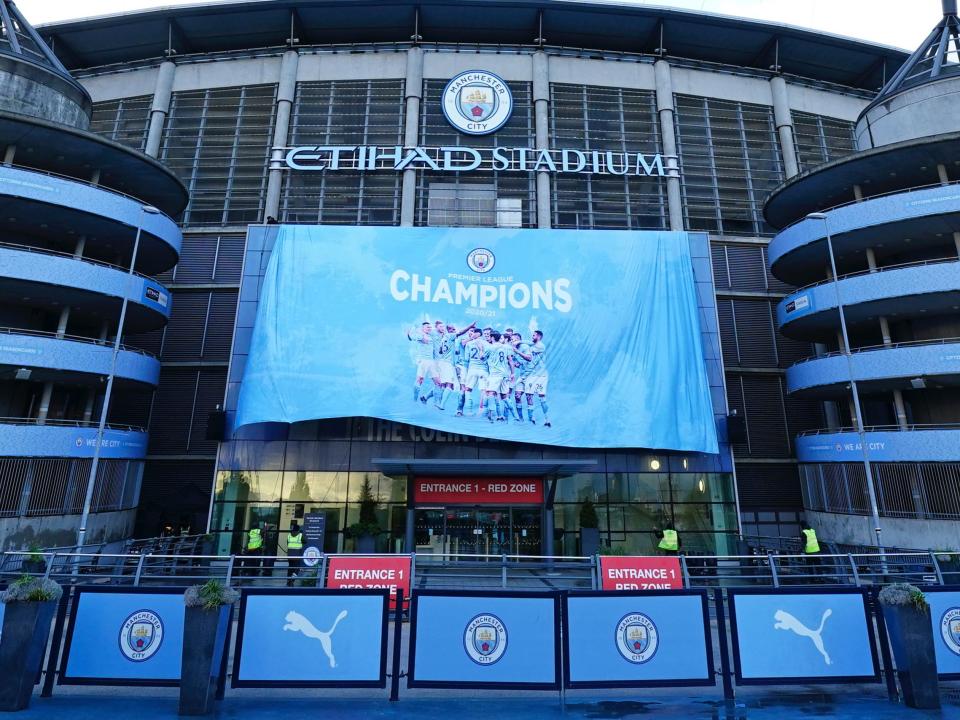 A Premier League champions banner is unfurled at Etihad Stadium (AP)