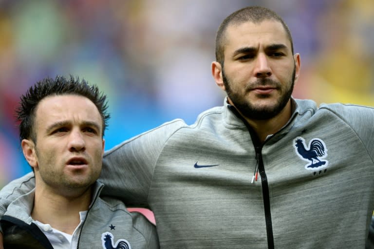 France striker Karim Benzema (right) has been placed under investigation over an attempt to bribe teammate Mathieu Valbuena for a sex-tape