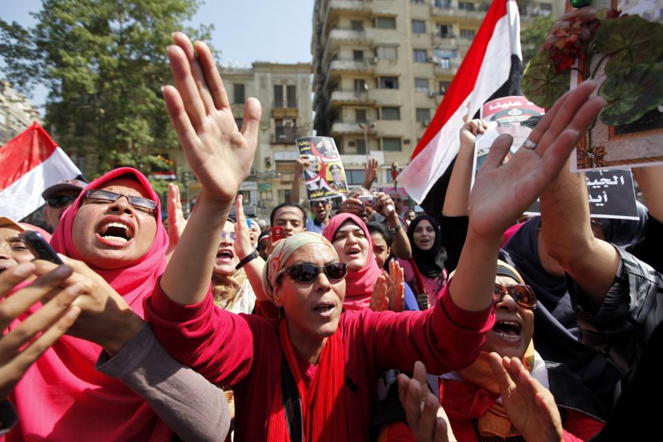 People chant pro-military slogans in Tahrir square as they celebrate the anniversary of an attack on Israeli forces during the 1973 war, in Cairo