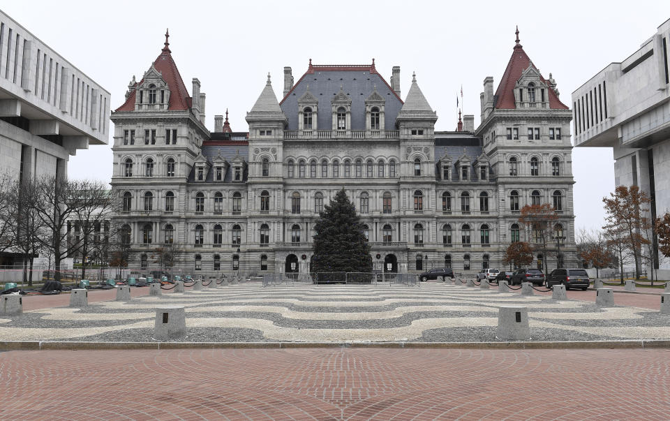 FILE - This photo shows an exterior view of the New York state Capitol in Albany, N.Y., Monday, Dec. 14, 2020. On Thursday, Dec. 23, 2021, The Associated Press reported on stories circulating online incorrectly claiming New York lawmakers will vote Jan. 5 on a bill that would allow for the “indefinite detention of the unvaccinated.” (AP Photo/Hans Pennink, File)