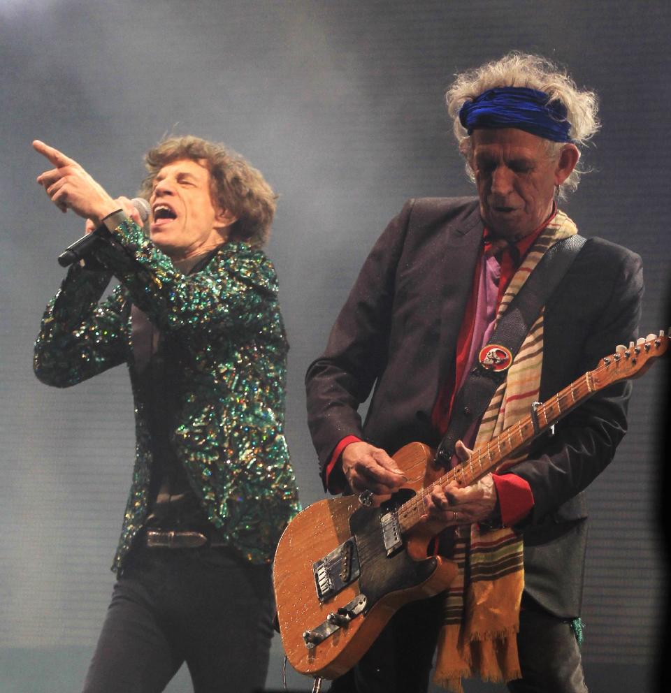 Mick Jagger and Keith Richards of The Rolling Stones perform at Glastonbury, England on Saturday, June 29, 2013. Thousands are to enjoy the three day festival that started on Friday, June 28, 2013 with headliners Arctic Monkeys, the Rolling Stones and Mumford and Sons. (Photo by Jim Ross/Invision/AP)