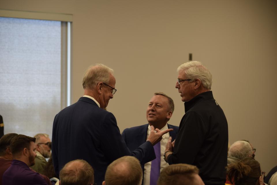 Sen. Jerry Moran speaks with K-State President Richard Linton, middle, and Salina Airport Authority Director Tim Rogers, right, shortly before announcing $33.5 million in grants to the Kansas State University Salina Aerospace and Technology Campus, located at the airport.