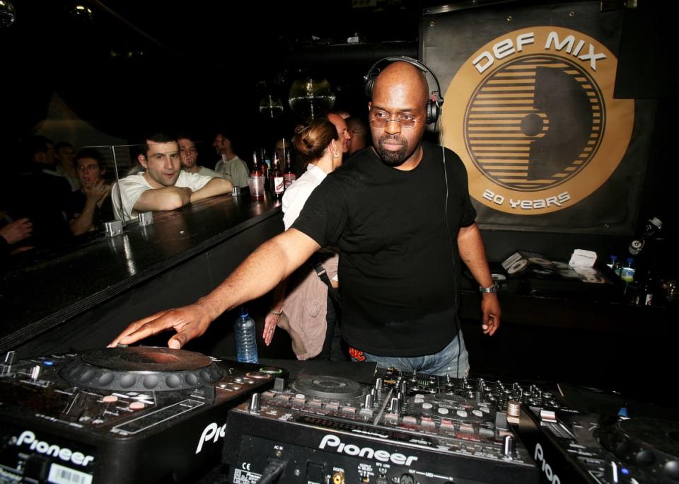 DJ <span class="caas-xray-inline-tooltip"><span class="caas-xray-inline caas-xray-entity caas-xray-pill rapid-nonanchor-lt" data-entity-id="Frankie_Knuckles" data-ylk="cid:Frankie_Knuckles;pos:1;elmt:wiki;sec:pill-inline-entity;elm:pill-inline-text;itc:1;cat:Musician;" tabindex="0" aria-haspopup="dialog"><a href="https://search.yahoo.com/search?p=Frankie%20Knuckles" data-i13n="cid:Frankie_Knuckles;pos:1;elmt:wiki;sec:pill-inline-entity;elm:pill-inline-text;itc:1;cat:Musician;" tabindex="-1" data-ylk="slk:Frankie Knuckles;cid:Frankie_Knuckles;pos:1;elmt:wiki;sec:pill-inline-entity;elm:pill-inline-text;itc:1;cat:Musician;" class="link ">Frankie Knuckles</a></span></span> plays at the Def Mix 20th Anniversary Weekender at Turnmills nightclub on May 6, 2007 in London, England. (Photo by Claire Greenway/Getty Images)