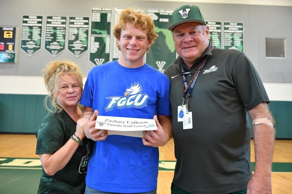 Venice High baseball player Zachary Calhoon poses for a photo with his parents Kim and Pat. Calhoon during a ceremony for Venice High athletes in the school's gym on Feb. 5, 2020. HERALD-TRIBUNE STAFF FILE PHOTO/Mike Lang