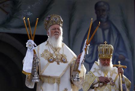 Patriarch Kirill of Moscow and All Russia (R) and Ecumenical Orthodox Patriarch Bartholomew I hold a liturgy to mark 1,700 years since the Edict of Milan, when Roman emperor Constantine issued instructions to end the persecution of Christians, in the southern Serbian city of Nis October 6, 2013. REUTERS/Marko Djurica