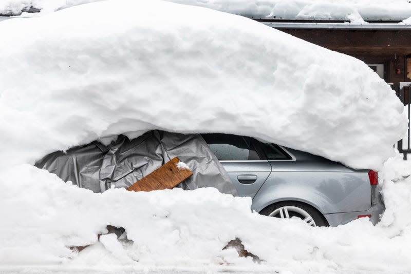 Photo of snow buried car