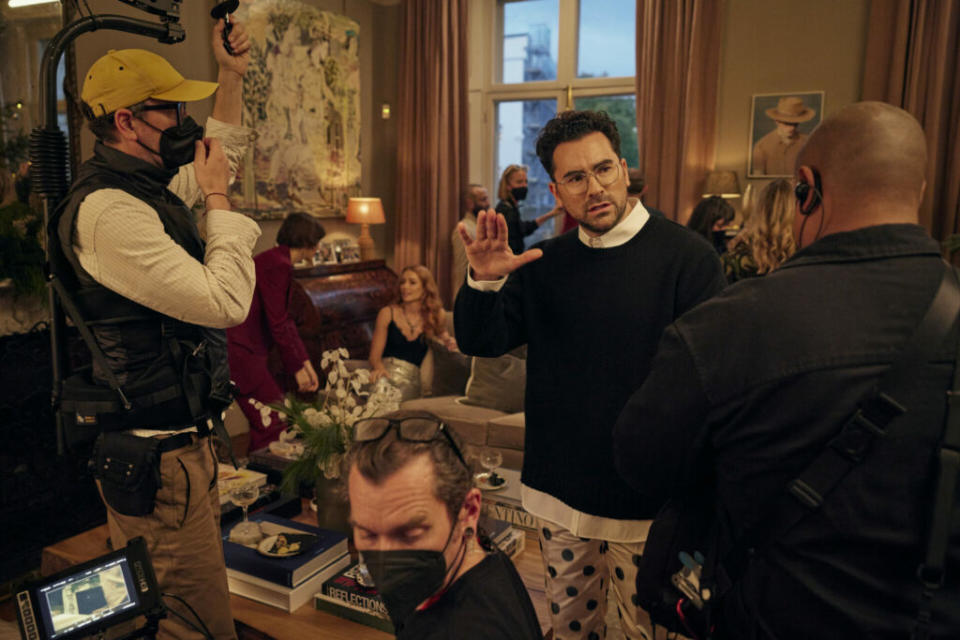 Good Grief – BTS – (Center) Writer, Director, Producer, Actor Daniel Levy with crew members on the set of Good Grief. Cr. Credit: Chris Baker / Netflix © 2023.