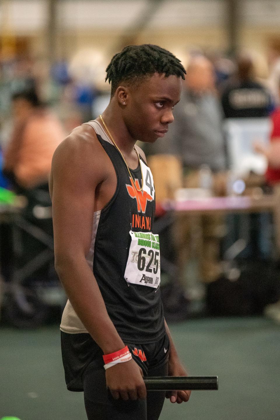 Winnebago's Supreme Muhammad eyes the track as he was getting ready to run one of the sprint relay events at last year's Illinois Top Times Indoor Championships in Bloomington.