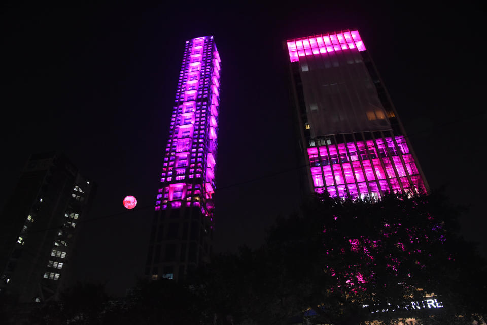 The tallest building 42 and Tata Center Pink illuminated on November 21,2019 in Kolkata,India. a historic venue, getting ready to host Indias first Day-Night Pink Ball Test from November 22. Indias opponent is Bangladesh and the haze seems to denote the mists of time through which Kolkatas prized playing field has come with credit, being witness to many a humdinger across formats. (Photo by Debajyoti Chakraborty/NurPhoto via Getty Images)