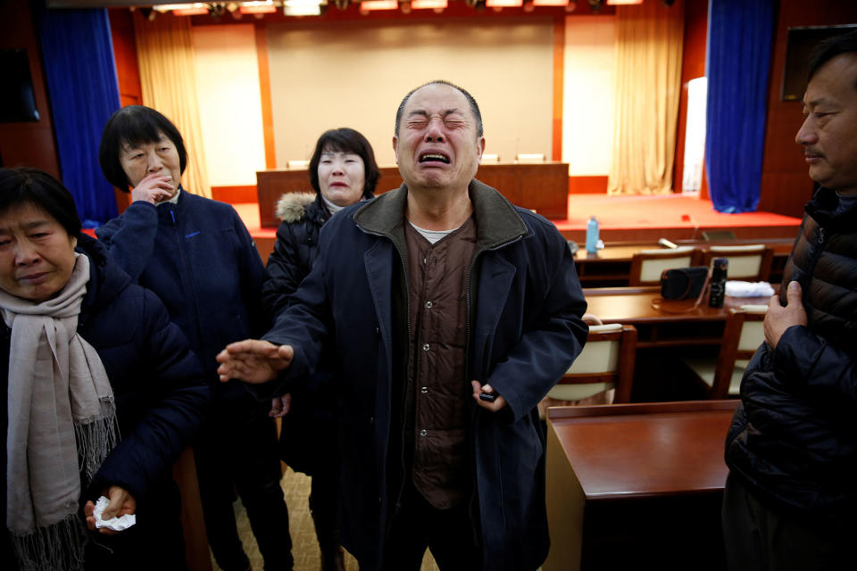 Relatives of passengers onboard Malaysia Airlines flight MH370 react