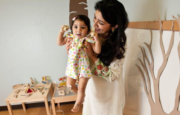 The author with Rehma at her first birthday party in January 2013, after she had dug into her cake. Rehma died a few days later. (Photo: Courtesy of Simi Rabinowitz Photography)