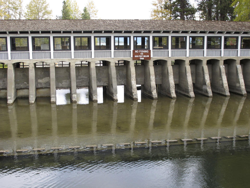 The gates are open at the dam on Lake Tahoe but no water is flowing into the mouth of the Truckee River Wednesday, Oct. 20, 2021 in Tahoe City, Calif. Drought fueled by climate change has dropped Lake Tahoe below its natural rim and halted flows into the Truckee River, an historically cyclical event that's occurring sooner and more often than it used to _ raising fears about what might be in store for the famed alpine lake. (AP Photo/Scott Sonner).