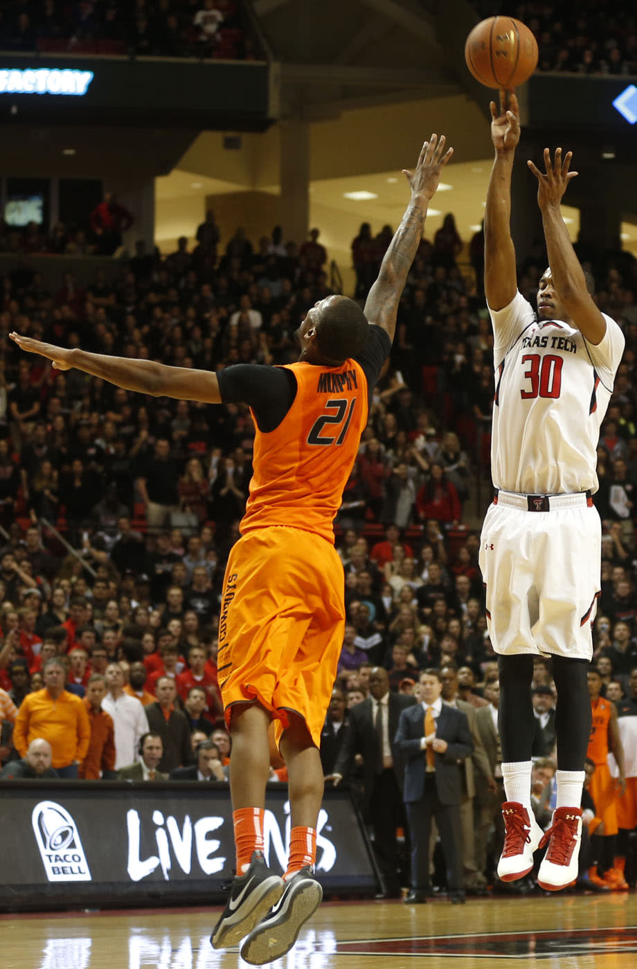 Texas Tech's Jaye Crockett(30) shoots over Oklahoma State's Kamari Murphy(21) during their NCAA college basketball game in Lubbock, Texas, Saturday, Feb, 8, 2014. (AP Photo/Lubbock Avalanche-Journal, Tori Eichberger) ALL LOCAL TV OUT