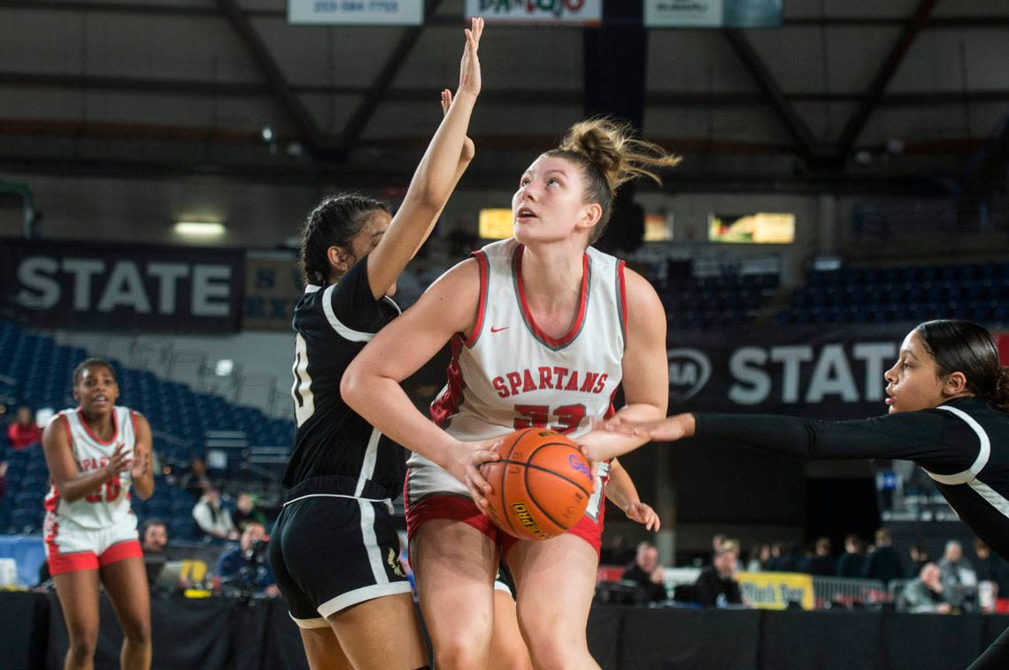 Stanwood forward Vivienne Berrett (53) looks to shoot in the third quarter against Lynnwood in the opening round of the Class 3A girls state basketball tournament on Wednesday, March 1, 2023 at the Tacoma Dome in Tacoma, Wash.