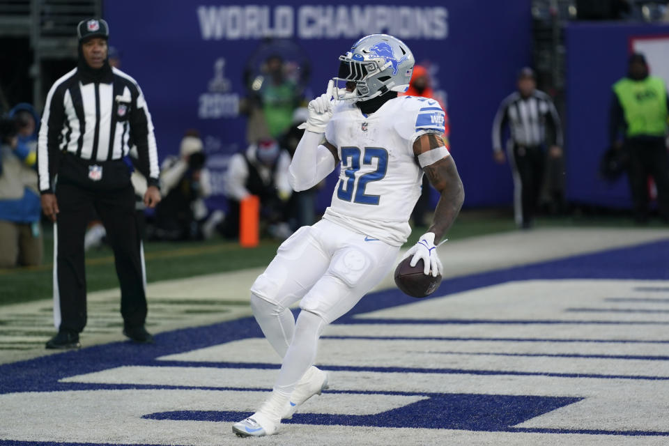 Detroit Lions running back D'Andre Swift (32) celebrates after scoring a touchdown during the second half of an NFL football game against the New York Giants, Sunday, Nov. 20, 2022, in East Rutherford, N.J. (AP Photo/Seth Wenig)