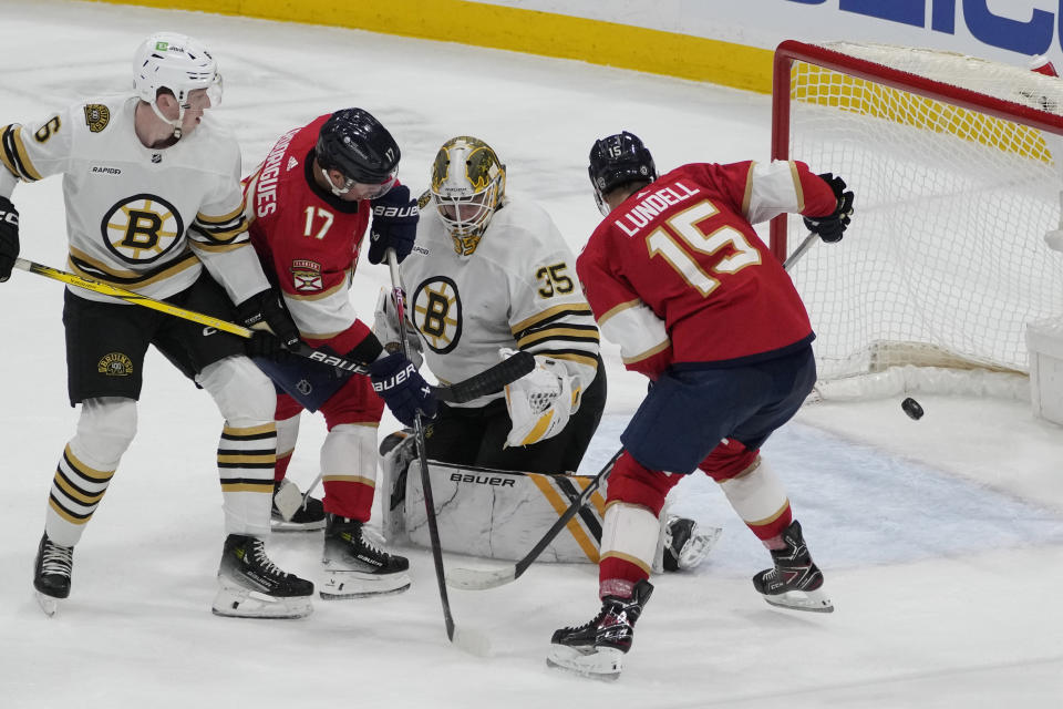 Florida Panthers center Anton Lundell (15) scores a goal against Boston Bruins goaltender Linus Ullmark (35) during the second period of an NHL hockey game, Wednesday, Nov. 22, 2023, in Sunrise, Fla. (AP Photo/Marta Lavandier)