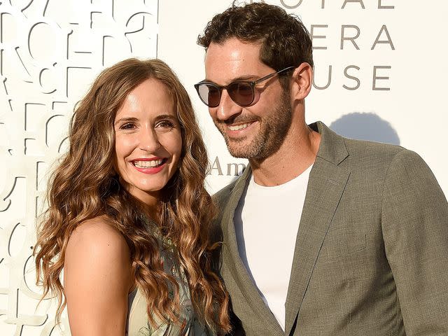 <p>Gregg DeGuire/Getty</p> Tom Ellis and his wife Meaghan Oppenheimer arrive at the American Friends Of Covent Garden 50th Anniversary Celebration on July 10, 2019 in Beverly Hills, California.