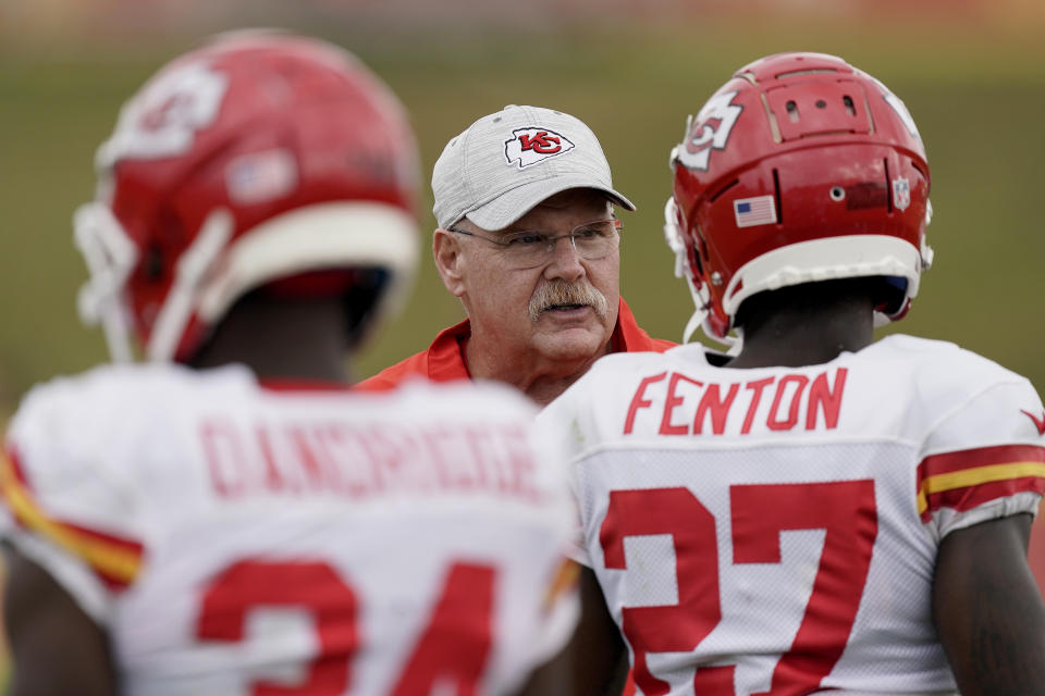 Kansas City Chiefs head coach Andy Reid talks to players during NFL football training camp Monday, Aug. 15, 2022, in St. Joseph, Mo. (AP Photo/Charlie Riedel)