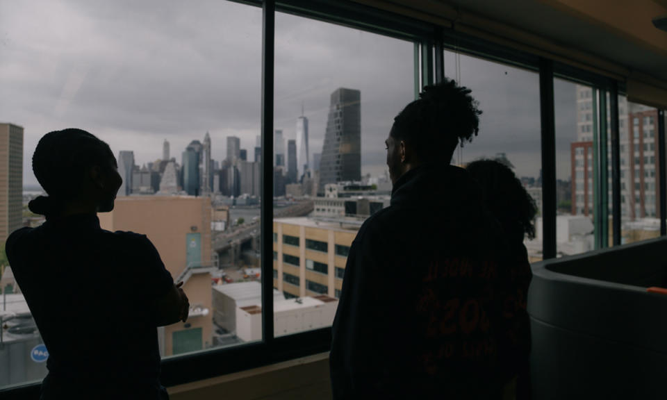 Seniors Jayla Eady, Anaya Martin and Daniel Shelton reflect on their time at Brooklyn Laboratory Charter as they overlook the Manhattan skyline. (Marianna McMurdock/The 74)<br>