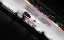 Canada's pilot Kaillie Humphries and Heather Moyse speed down the track during the women's bobsleigh event at the Sochi 2014 Winter Olympics February 19, 2014. REUTERS/Fabrizio Bensch (RUSSIA - Tags: OLYMPICS SPORT BOBSLEIGH)