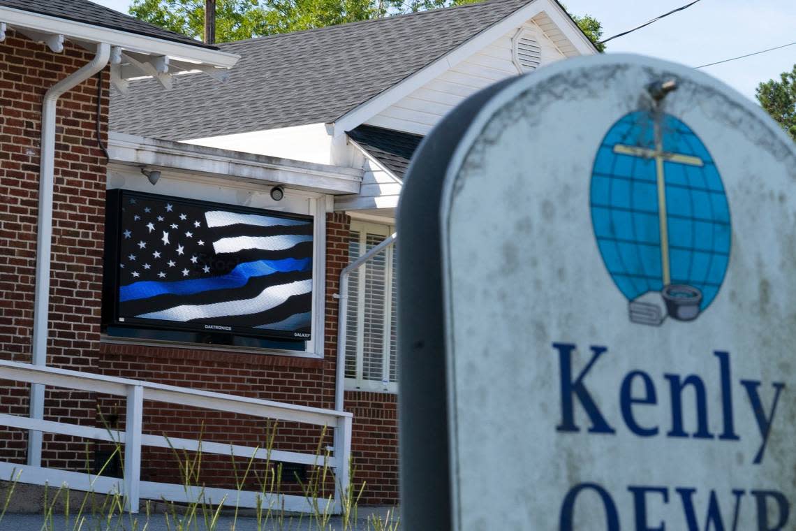 A screen outside of Kenly Medical Associates has a waving Thin Blue Line flag visible from the main street, 2nd Street, in Kenly, N.C. on Monday, July 25, 2022. The entire Kenly police department resigned last Wednesday in protest of the new town manager, Justine Jones.