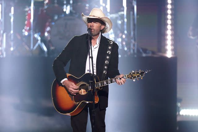 <p>Mickey Bernal/NBC via Getty</p> Toby Keith performs on stage during the 2023 People's Choice Country Awards held at the Grand Ole Opry on Sept. 28, 2023 in Nashville