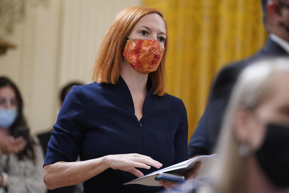 FILE - White House press secretary Jen Psaki listens as President Joe Biden speaks about Afghanistan from the East Room of the White House, Aug. 16, 2021, in Washington. Psaki, whose last day on the job is Friday, has answered reporters' questions nearly every weekday of the almost 500 days that Biden has been in office. That makes her a top White House communicator and perhaps the administration's most public face, behind only the president and Vice President Kamala Harris. (AP Photo/Evan Vucci, File)