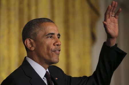 U.S. President Barack Obama waves after delivering remarks at a reception celebrating the signing into law of the African Growth and Opportunity Act at the East Room of the White House in Washington July 22, 2015. REUTERS/Carlos Barria