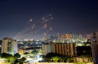 Streaks of light are seen from Ashkelon as Israel's Iron Dome anti-missile system intercepts rockets launched from the Gaza Strip towards Israel