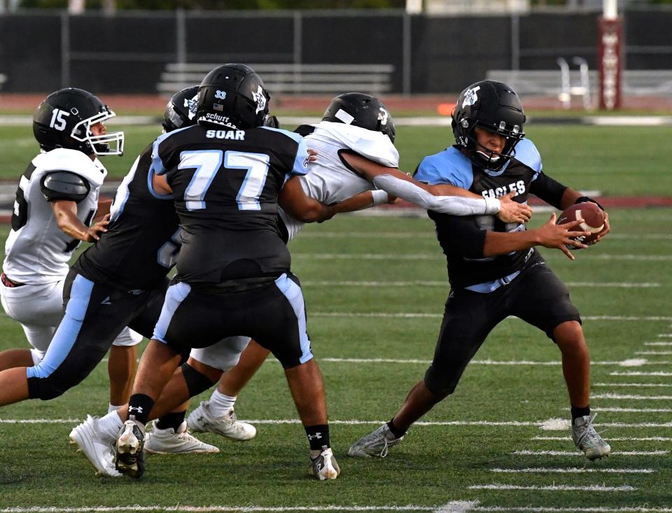 TCLA-Abilene quarterback Jonathan Rico tries to sidestep a Water Valley lineman during Thursday’s season opener against Water Valley at McMurry University’s Wilford Moore Stadium. Water Valley won 60-9.